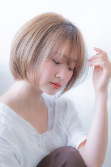 丸顔にも似合うシースルーバングの内巻きボブ 